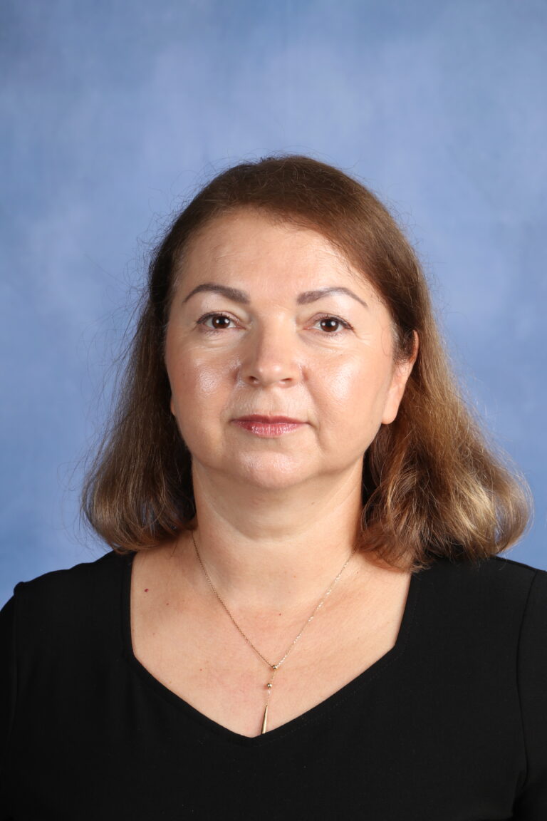 Portrait of Svetlana Chekerenda with a neutral expression.
